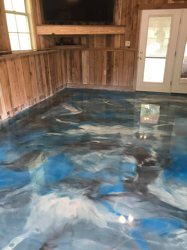 metallic epoxy coated floor in shades of blue, black, and silver